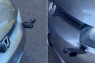 Motorista encontra arma cravada no parachoque do carro